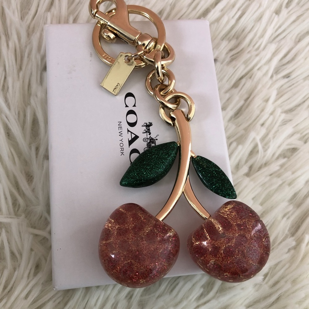 Coach Gold-Tone Cherry Keychain with Green Glitter Leaves